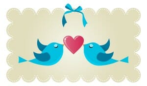 Two twitter birds fall in love holding a red heart background. Vector file available.
